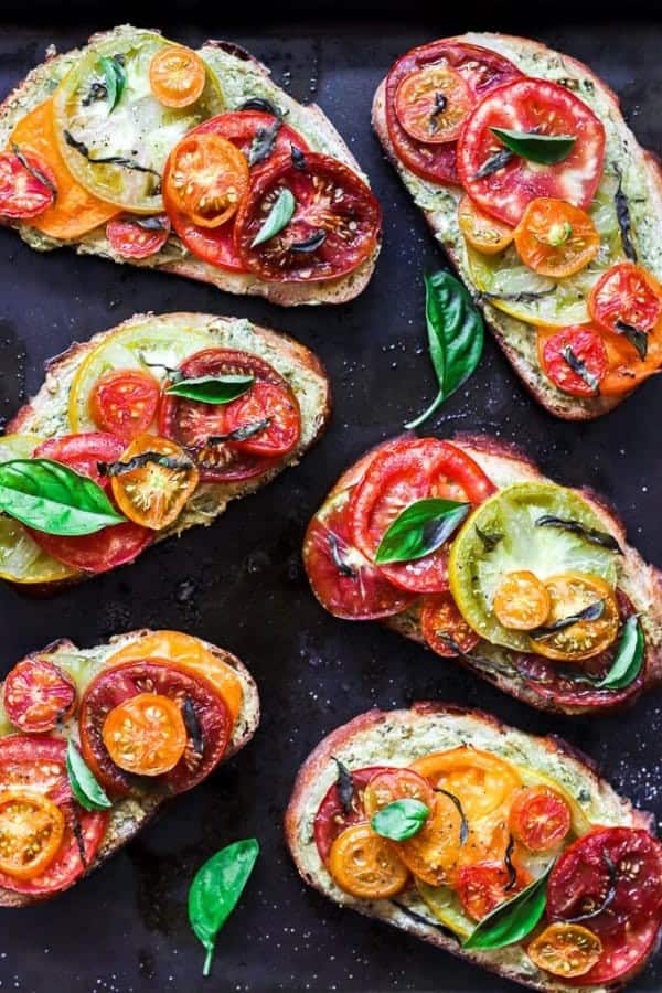 ROASTED TOMATO AND PUMPKIN SEED PESTO TOASTS