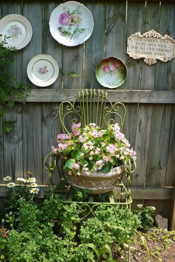 ANTIQUE WIRE FRAME CHAIR WITH ANTIQUE PLATES