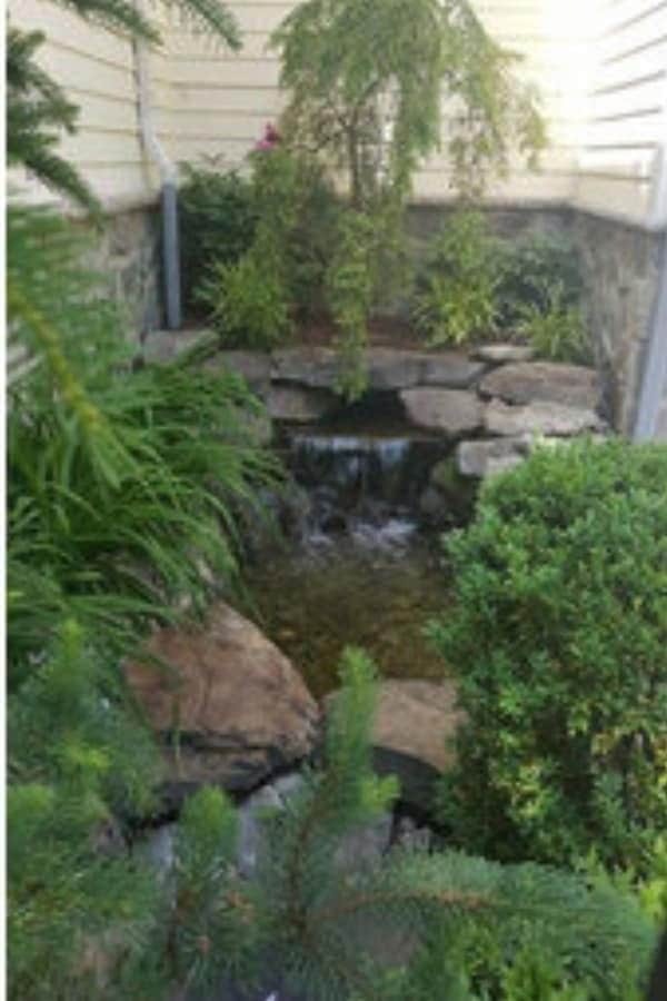 TRADITIONAL BACKYARD BRICK WATERFALL