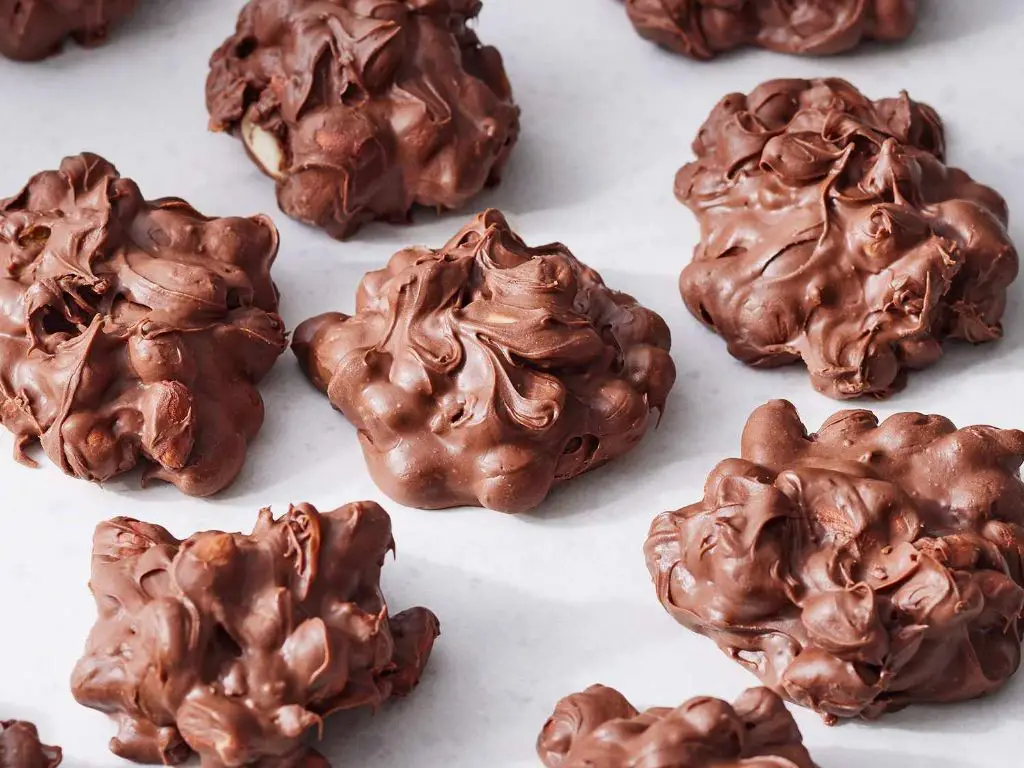 Chocolate Peanut Clusters with chocolate chips, peanuts, and peanut butter.