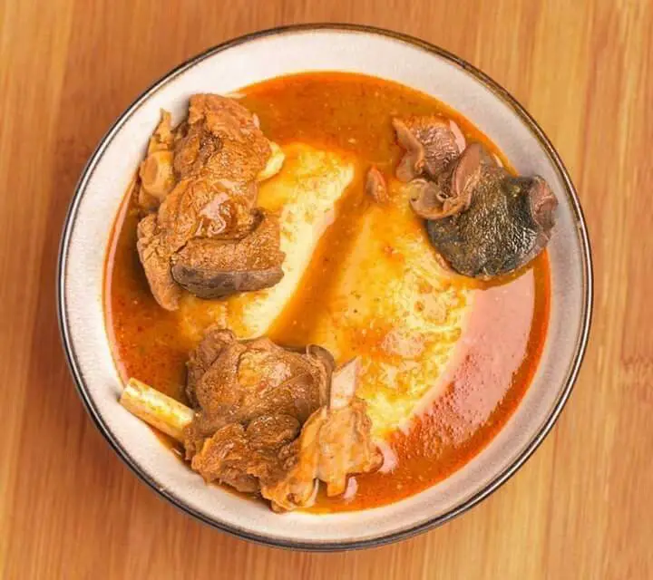 Fufu with Light Soup and Goat Meat