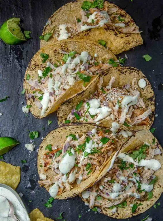Spicy Shredded Chicken Tacos with Avocado Crema
