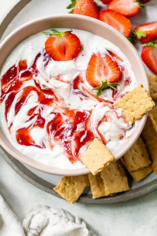 Strawberry Cheesecake Dip with strawberries, cream cheese, and sugar.