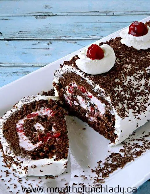 Black Forest Cake Roll with Cherries and Whipped Cream