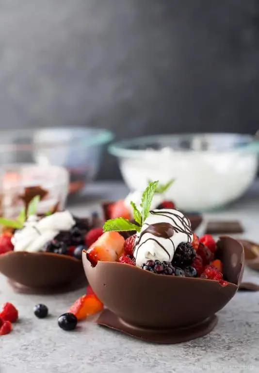 Chocolate Bowl Filled with Fresh Berries and Whipped Cream