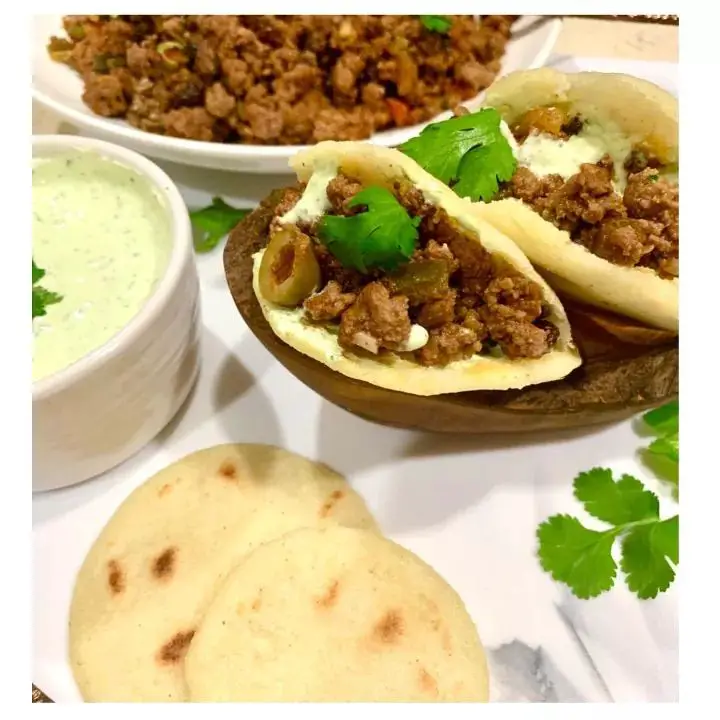 Cuban Beef and Cheese Arepas with Cilantro Lime Sauce