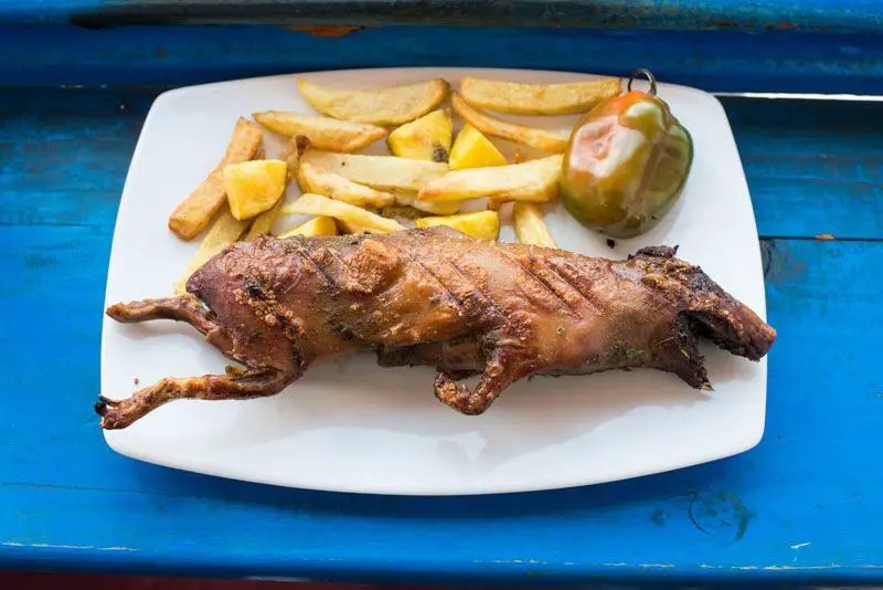 Cuy asado with potatoes
