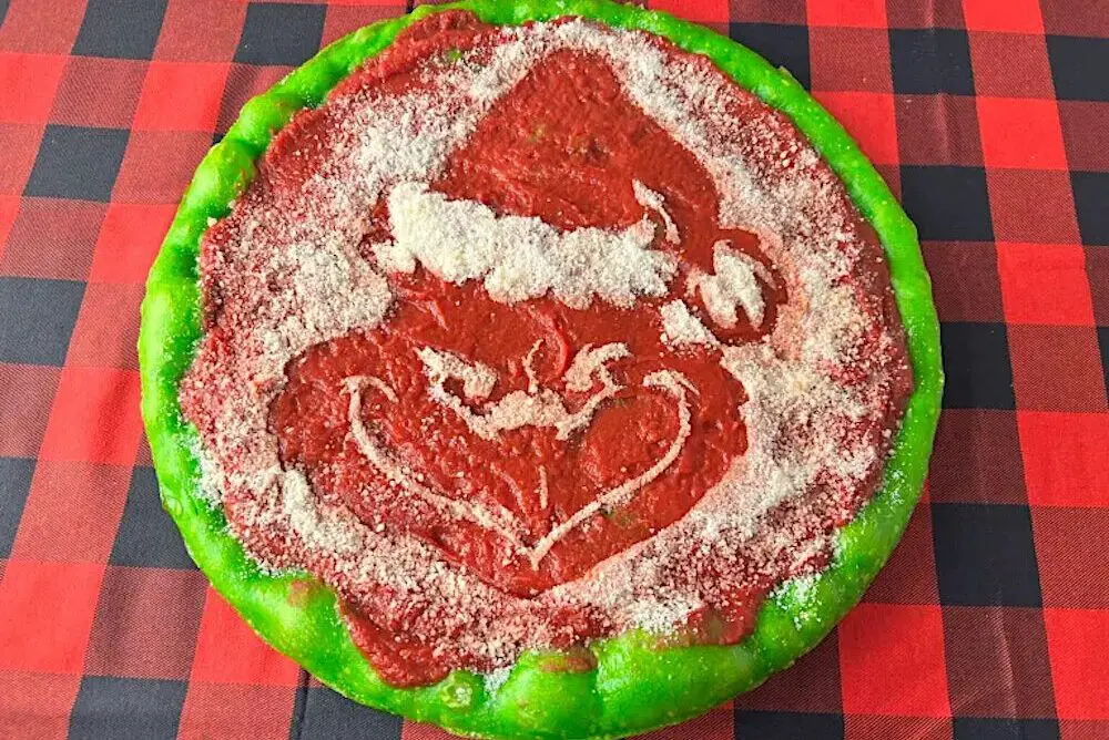 Grinch Pizza with Green Pesto Sauce
