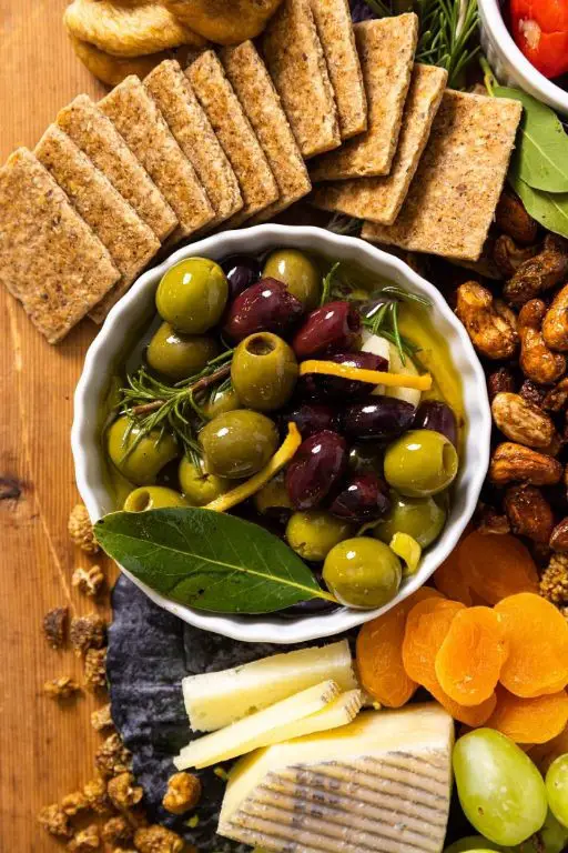 Herb-Infused Charcuterie Board with Olives