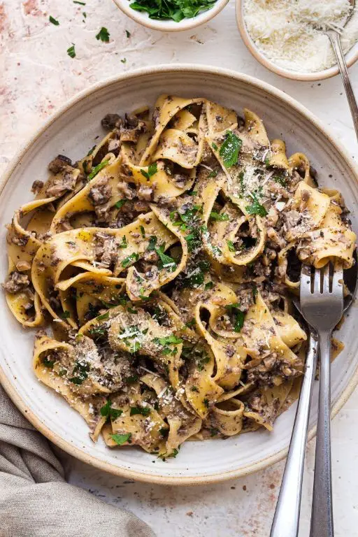 Herb-Infused Tagliatelle with Mushroom Cream Sauce