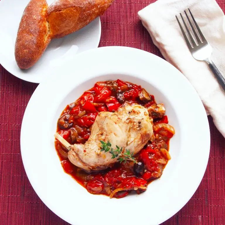 Rabbit cacciatore with tomatoes and olives