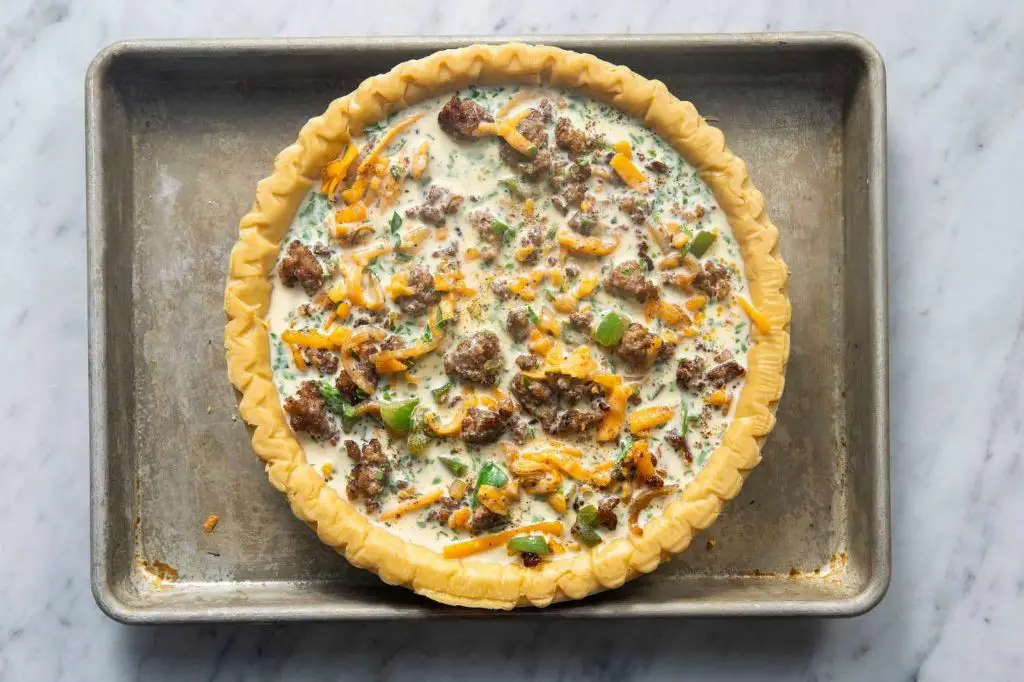 Sausage and Sauerkraut Quiche with Cheddar Crust