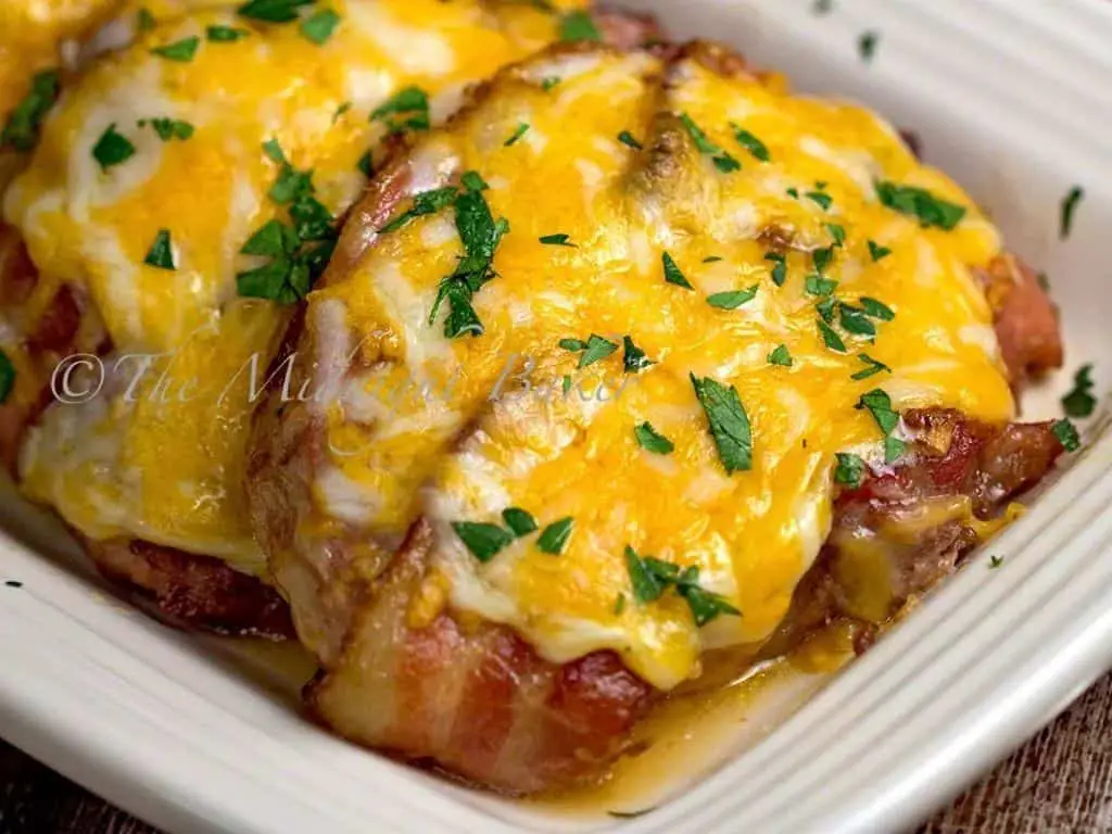Smothered Pork Chops with Bacon and Cheddar