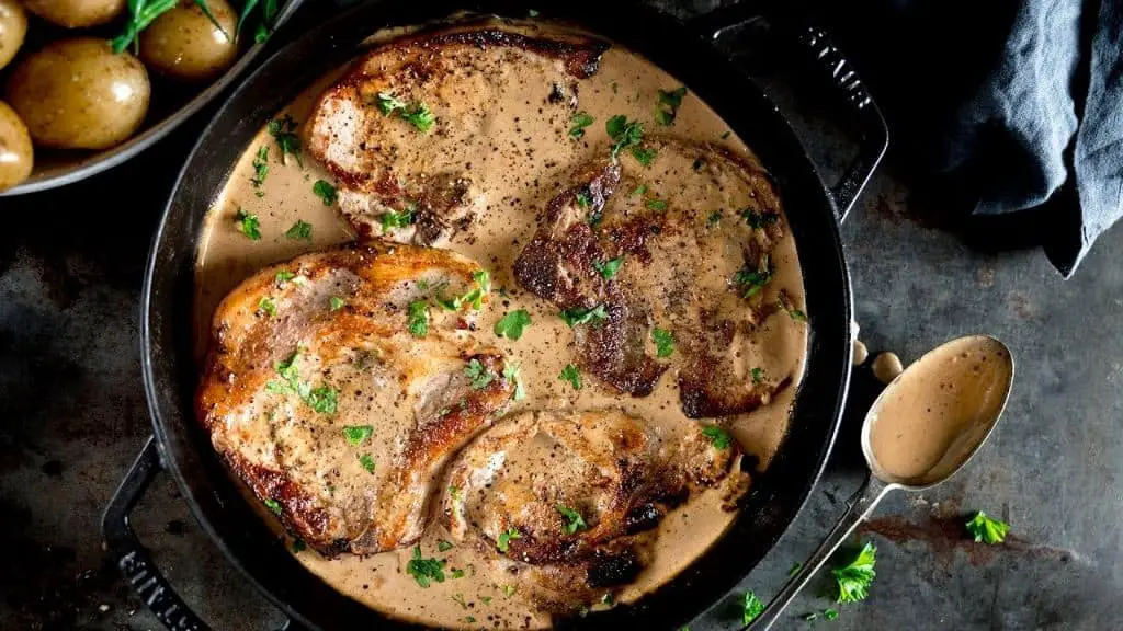Smothered Pork Chops with Creamy Mustard Sauce