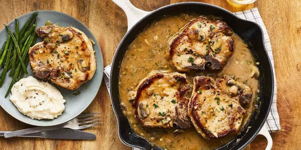 Smothered Pork Chops with Roasted Garlic Gravy