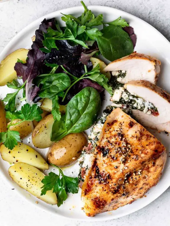 Spinach and Feta Stuffed Baked Chicken Breast with Garlic Cream Sauce