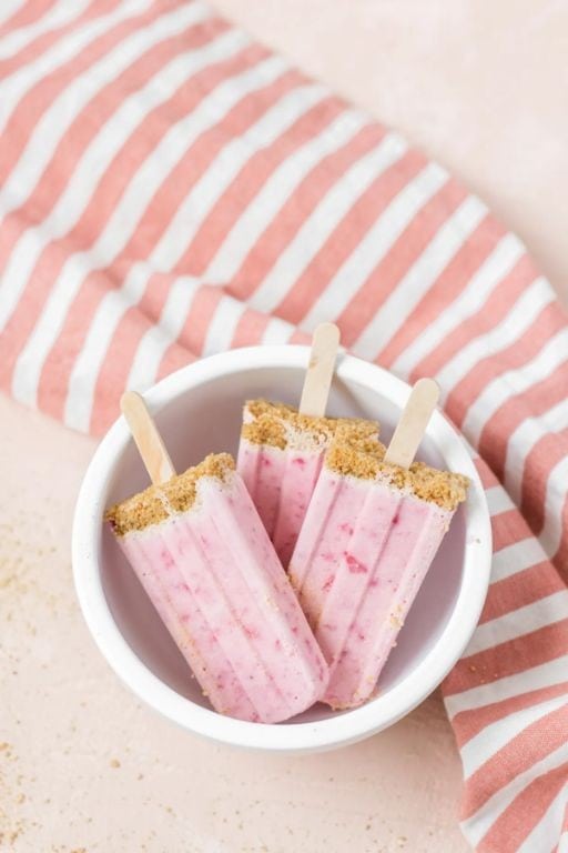 Strawberry Cheesecake Popsicles with Graham Cracker Crumbs