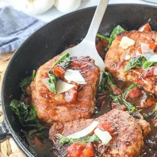 Cheesy Pork Chop Skillet with Spinach and Tomatoes
