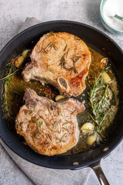 Pan-Seared Thick Bone-In Pork Chops with Garlic Rosemary