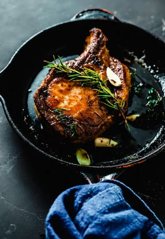 Thick Bone-In Pork Chops with Roasted Garlic and Thyme